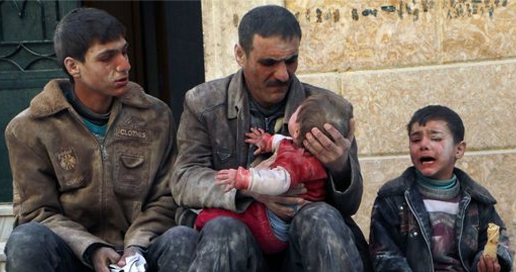 a-man-holds-a-baby-saved-from-under-rubble-who-survived-what-activists-say-was-an-airstrike-by-forces-loyal-to-syrian-president-bashar-al-assad-in-masaken-hanano-in-aleppo_Reuters1
