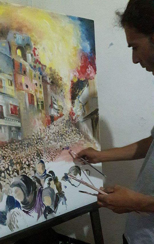 مضري حسن إبراهيم يرسم لوحته «آخر أيام التهجير»